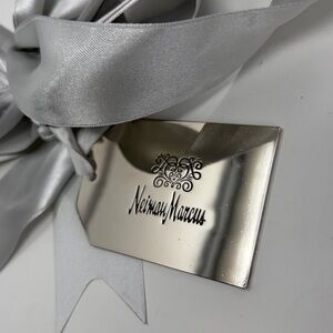 The Heart of Giving, Neiman Marcus silver gift tag with silver/gray ribbon